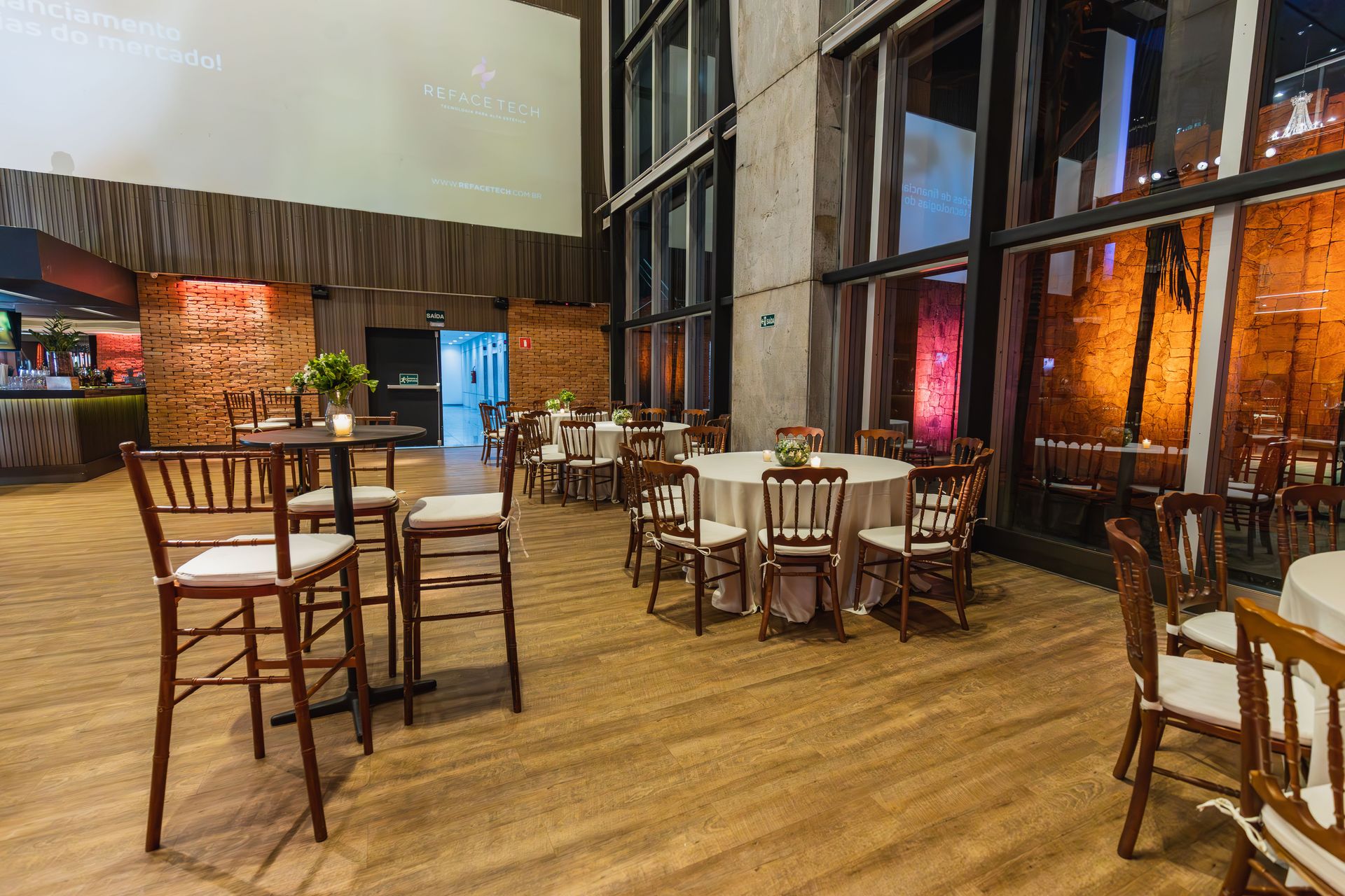 Spacious modern event hall with elegant decor ready for a celebration.
